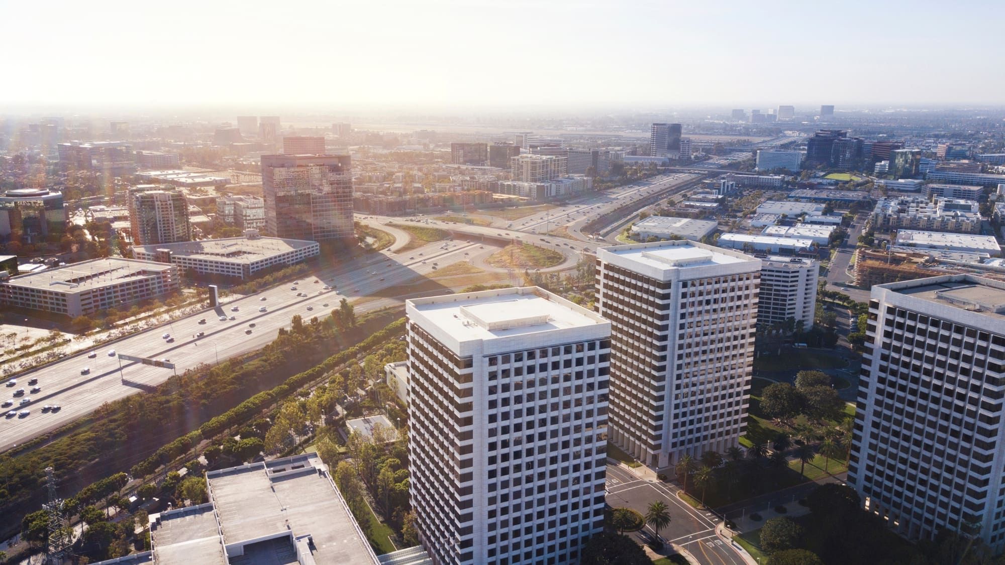Aerial drone photo of Irvine office towers beside the 405 freeway in Orange County