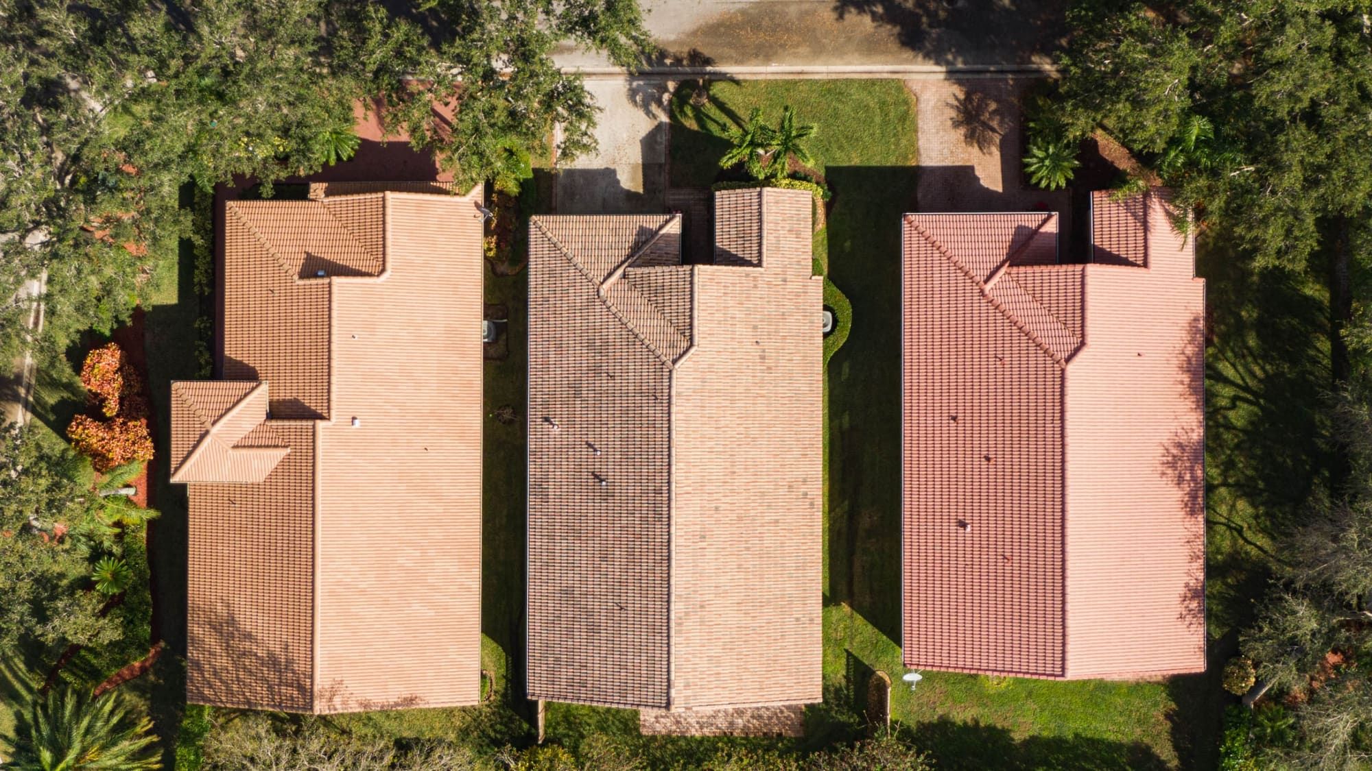 Top-down drone photo of residential tile roofs captured for inspection